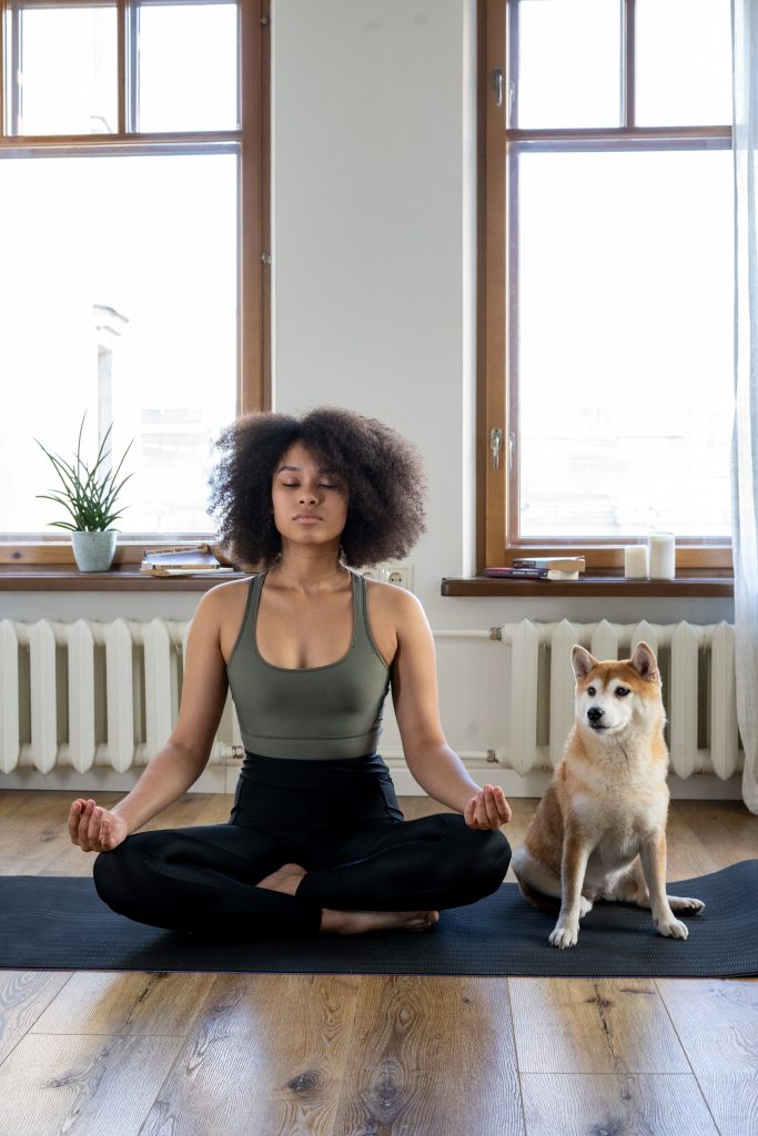 Woman meditating at home - Lisa Luna Reiki